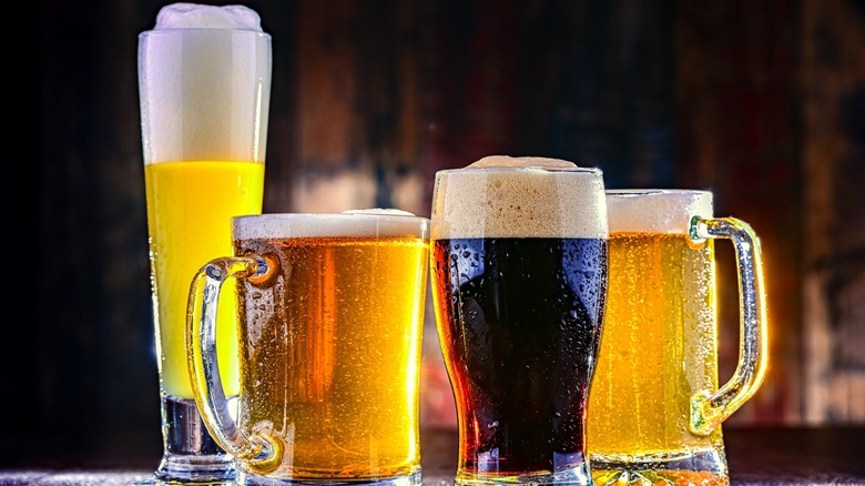 Multiple styles of beer served in an assortment of glasses.