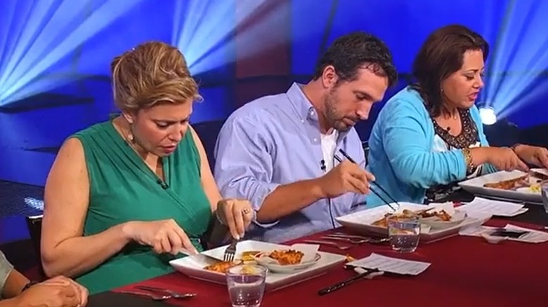 A panel of judges in Iron Chef America