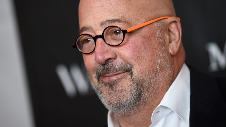 Andrew Zimmern smiling at an event