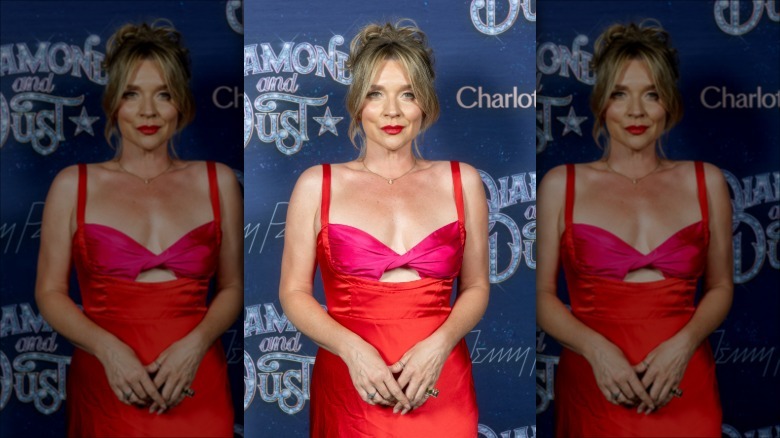 Candice Brown on red carpet in red