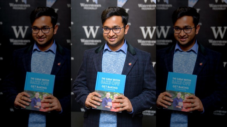 Rahul Madal with cookbook