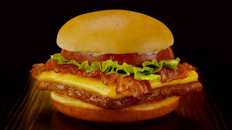 A bacon cheeseburger with square patty