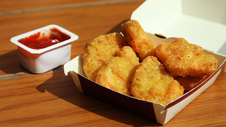 Open box of McDonald's chicken nuggets and sauce