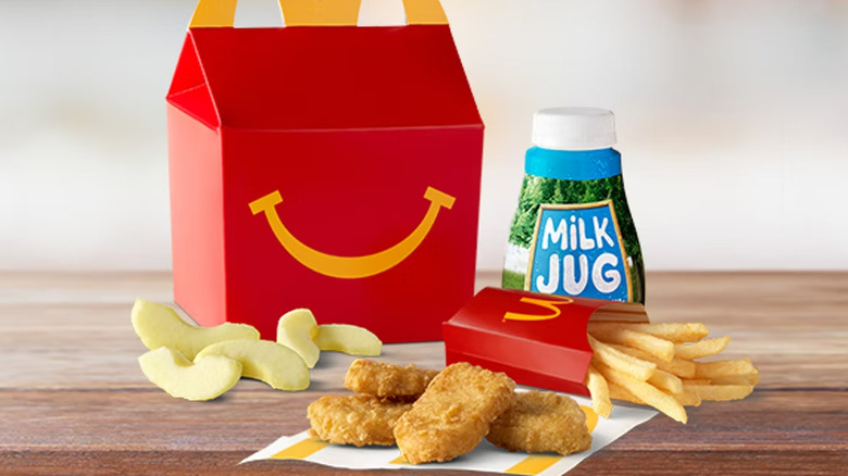 Mcdonald's Happy Meal with nuggets, fruit, milk, and fries