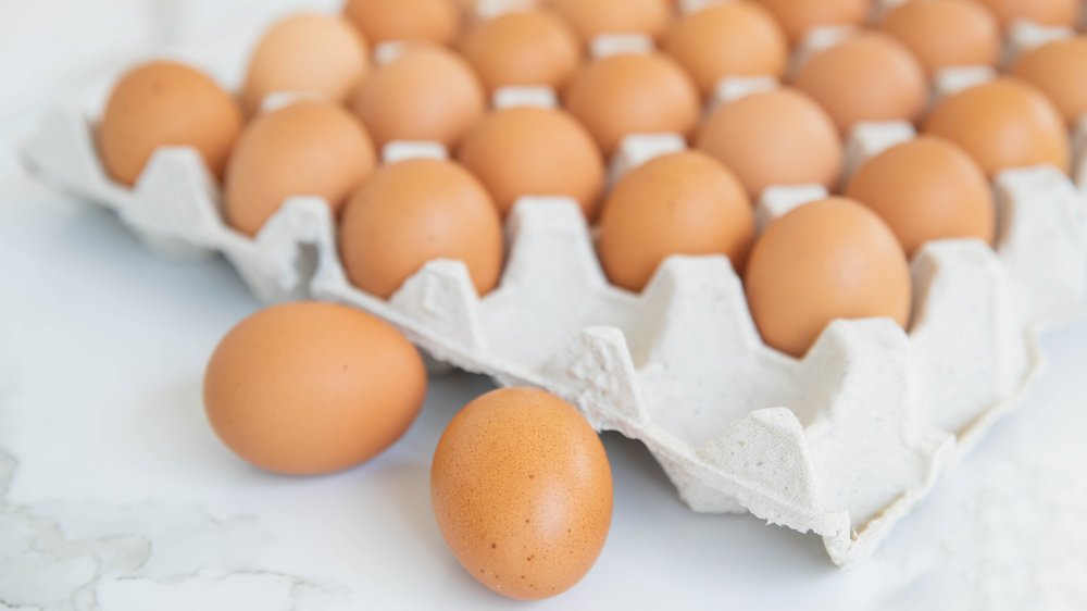 Large carton of brown eggs