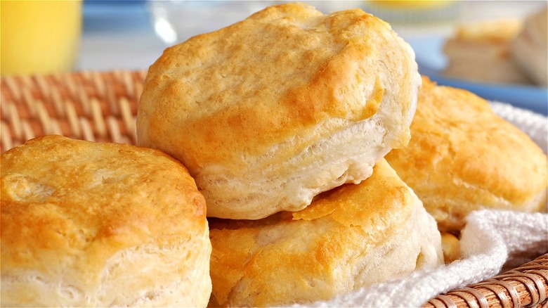 Golden biscuits on cloth in shallow basket