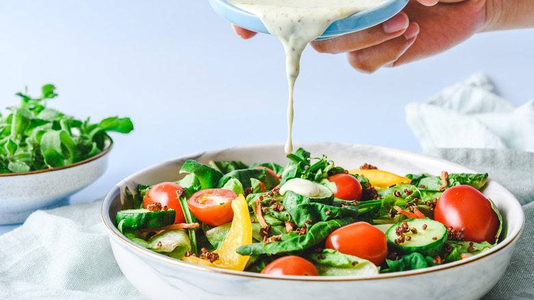 Dressing poured over salad