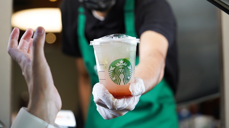 Person ordering Starbucks at a drive thru