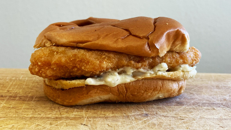 Fish sandwich on cutting board