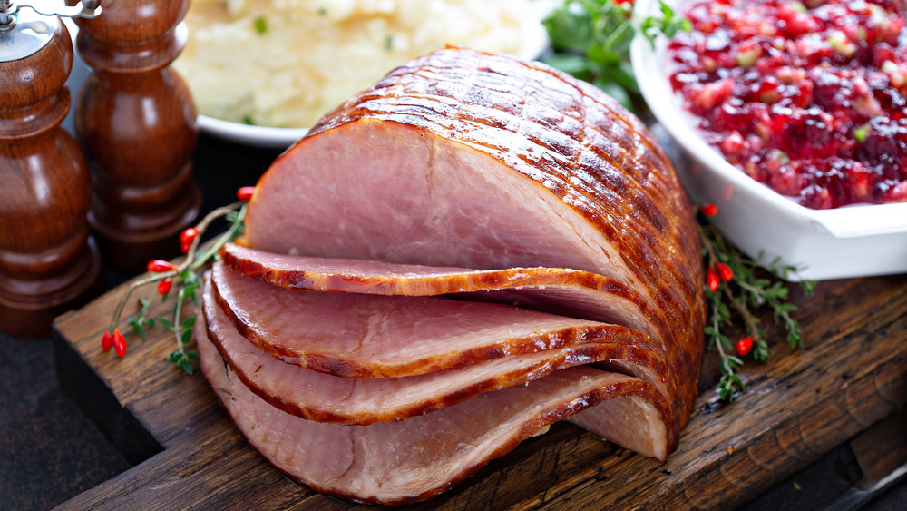 A holiday glazed ham on wood