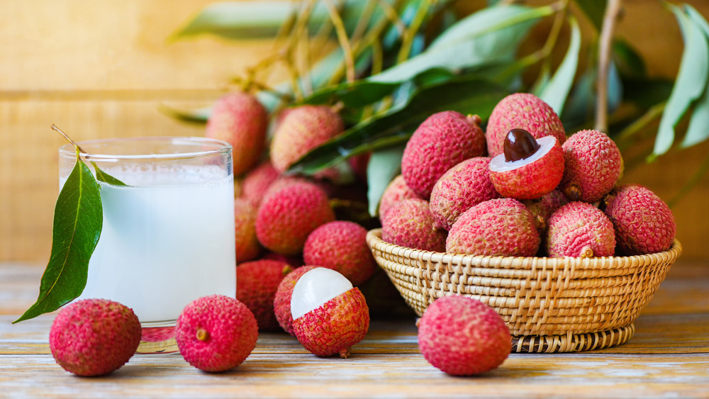 Basket of lychees, with juice