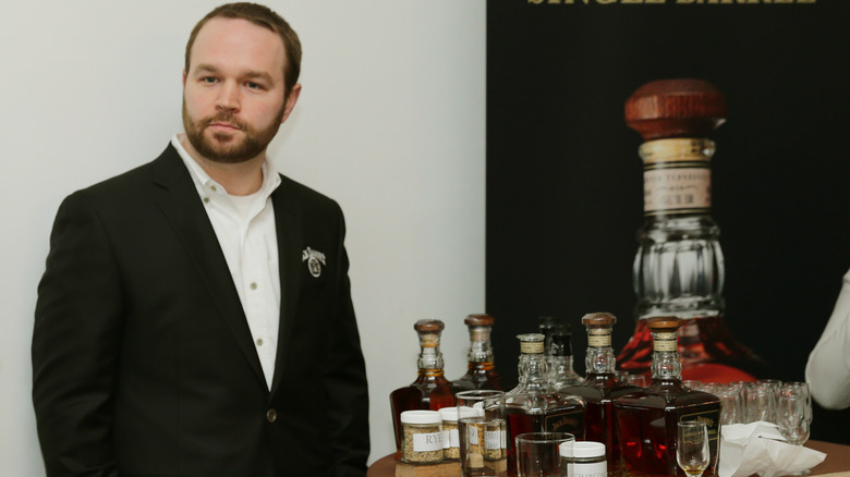 Chris Fletcher near whiskey bottles