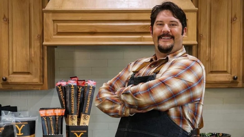 Chef Gabriel Guilbeau poses next to "Yellowstone" kitchen merch