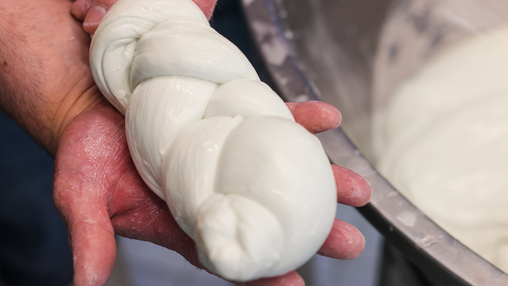 Buffalo mozzarella in a hand