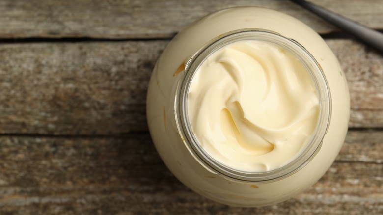 jar of mayonnaise on wooden table