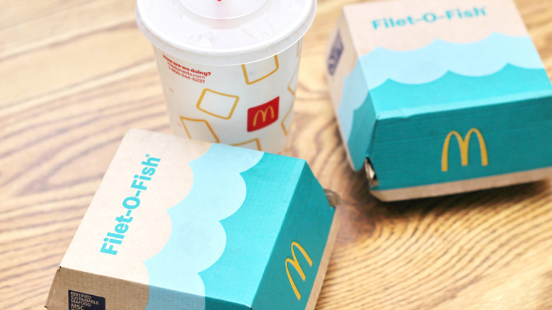 Two Filet-O-Fish boxes with McDonald's drink