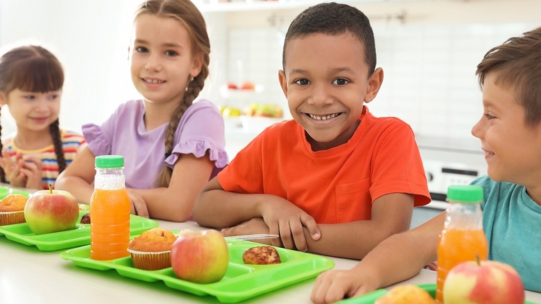 Happy children with school lunch