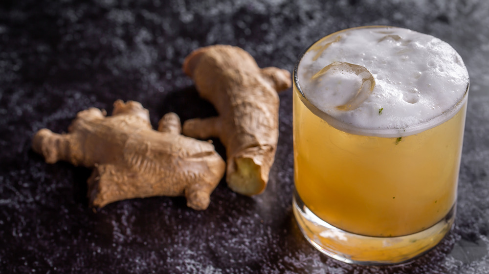 Cocktail next to ginger piece