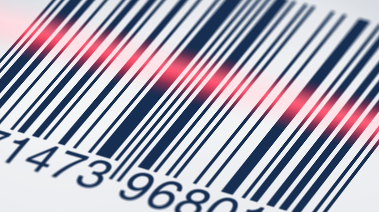 Barcode with the red line of a scanner light across it