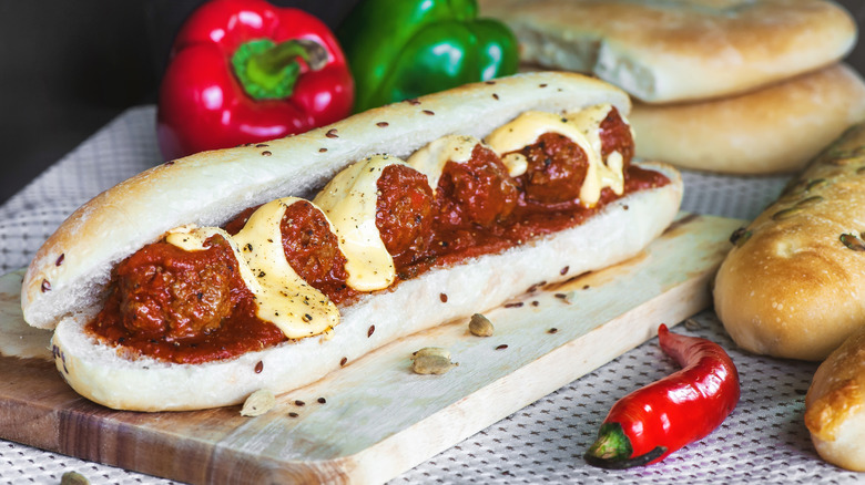 Meatball sandwich on cutting board