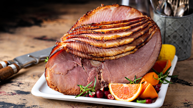 sliced ham on platter with fruit 