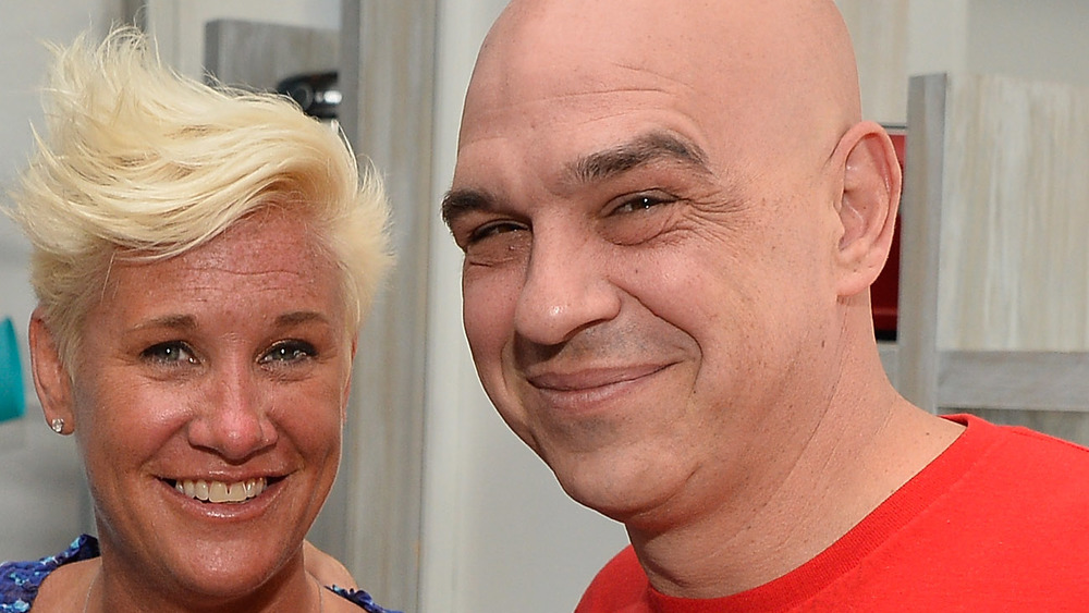 Anne Burrell and Michael Symon smiling