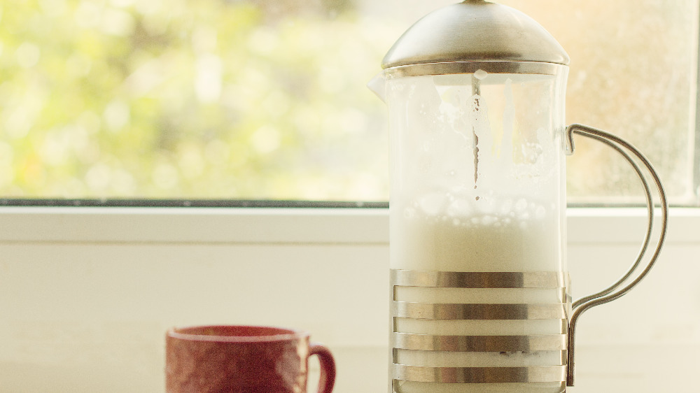 Frothed milk inside a French press