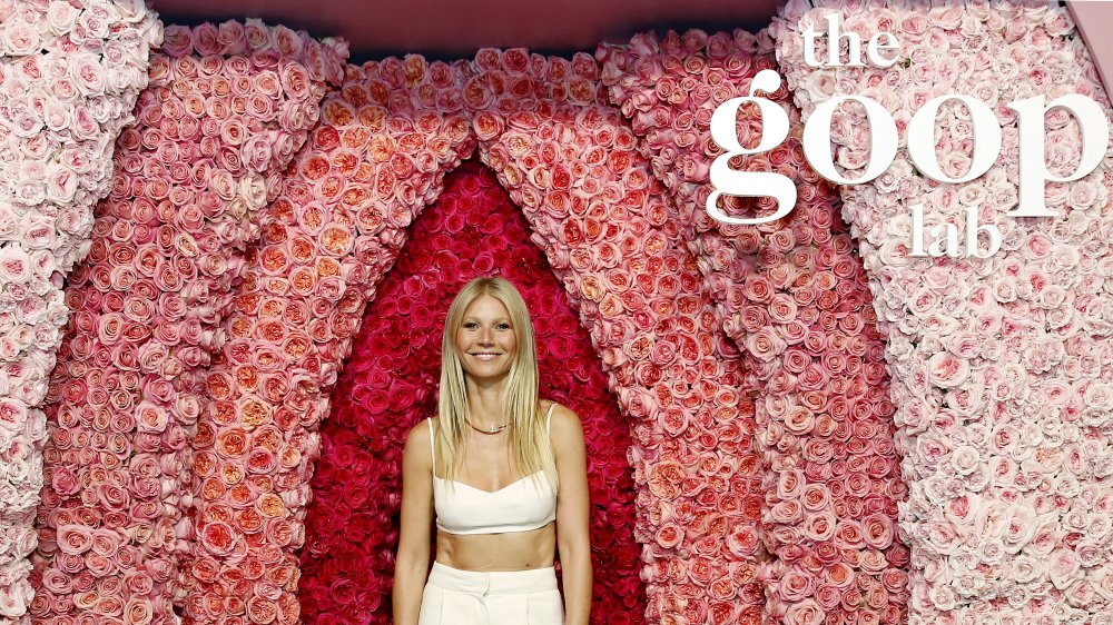 Gwyneth Paltrow against a flower background with the Goop Lab logo