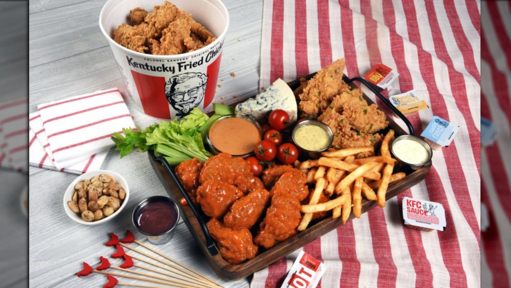 spread of chicken, wings, and fries with new sauce