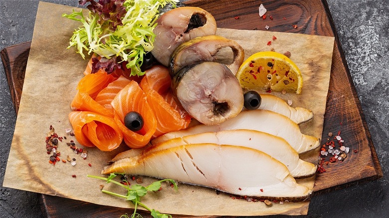 smoked fish with salmon on cutting board