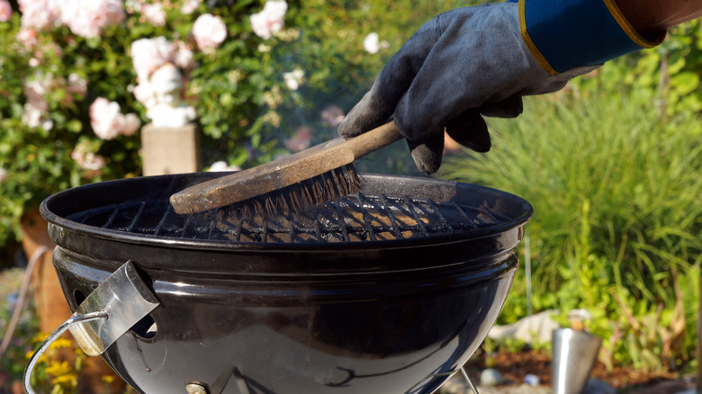 Cleaning grill with a brush