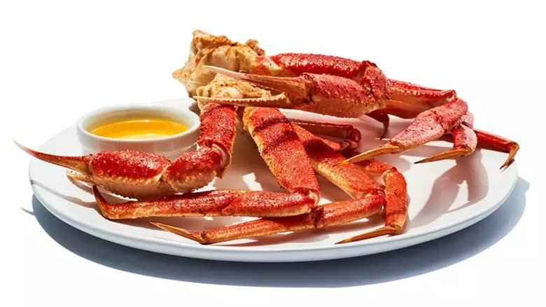 Crab legs on plate with butter