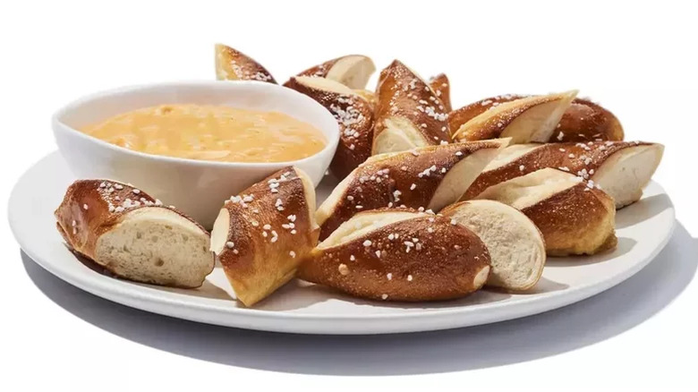 beer cheese and pretzels on plate