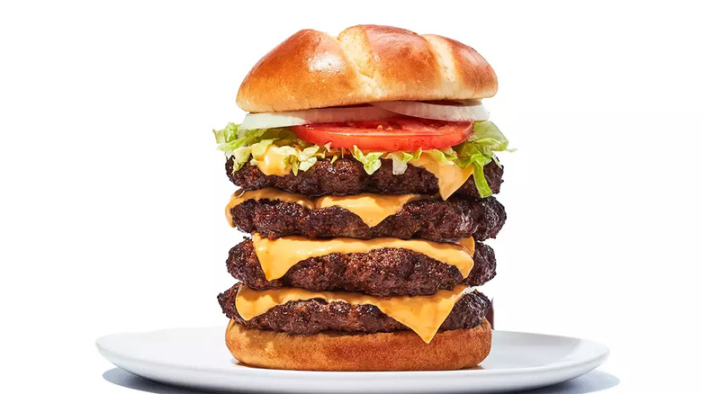 burgers stacked on top of buns