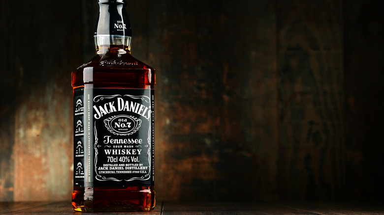 Bottle of Jack Daniel's on wooden background