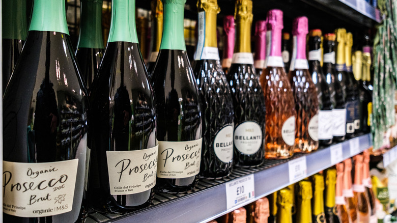 Bottles of Prosecco on a shelf