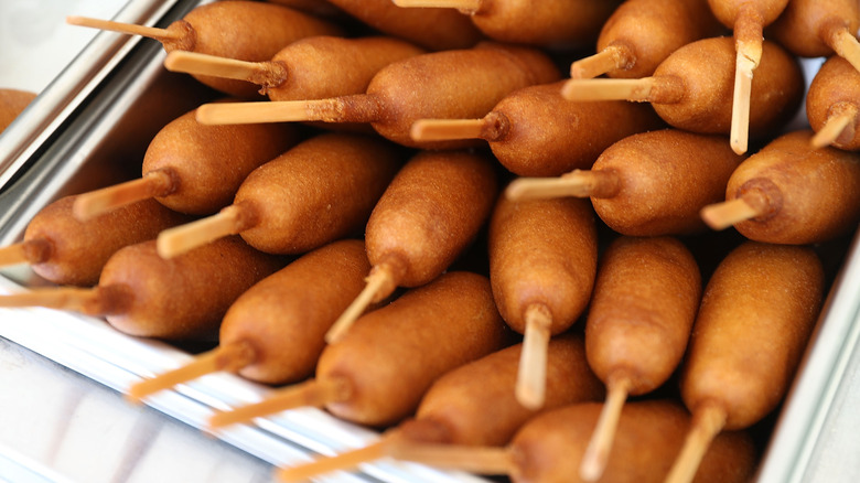 A pile of cooked corn dogs
