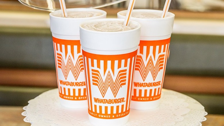 Orange and white Whataburger cups