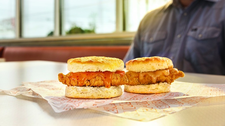 Two Whataburger biscuits on white and red paper