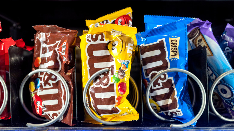 Close-up of M&M's candies in a vending machine