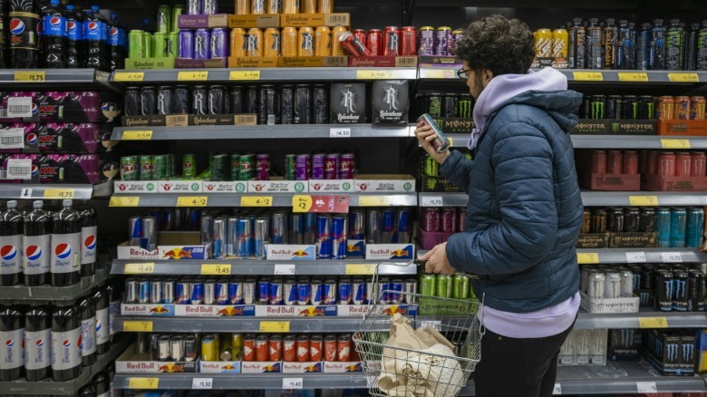 Customer shopping for energy drinks