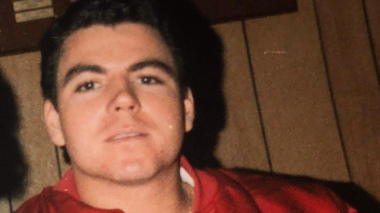 Young John Schnatter wearing red jacket