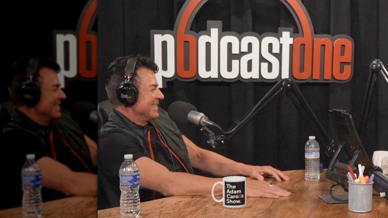 John Schnatter with headphones and microphone