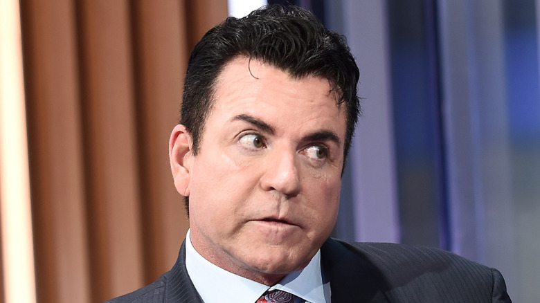 John Schnatter wearing suit and tie