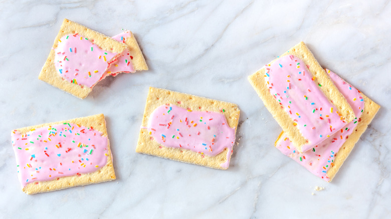 Pink frosted Pop-Tarts on a white marble background