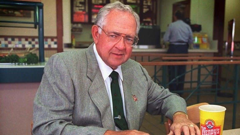 Dave Thomas sits next to his Wendy's drink.