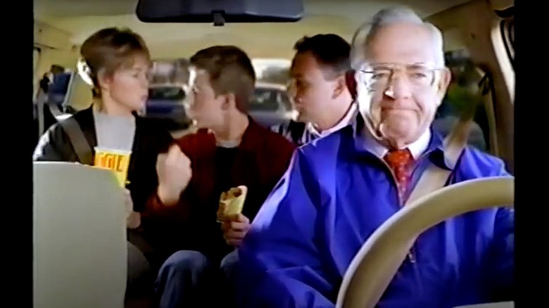 Dave Thomas drives a car with bickering family members in the back seat.