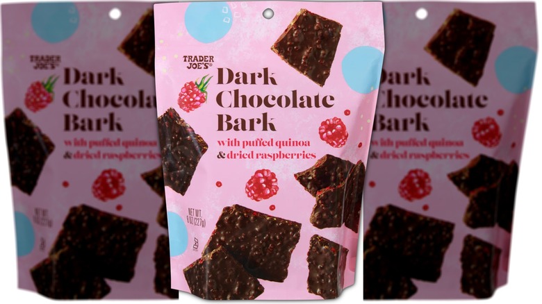 Bag of dark chocolate candy bark with raspberries and puffed quinoa.