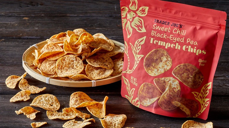 Bag of sweet chili flavored tempeh ships next to plate.