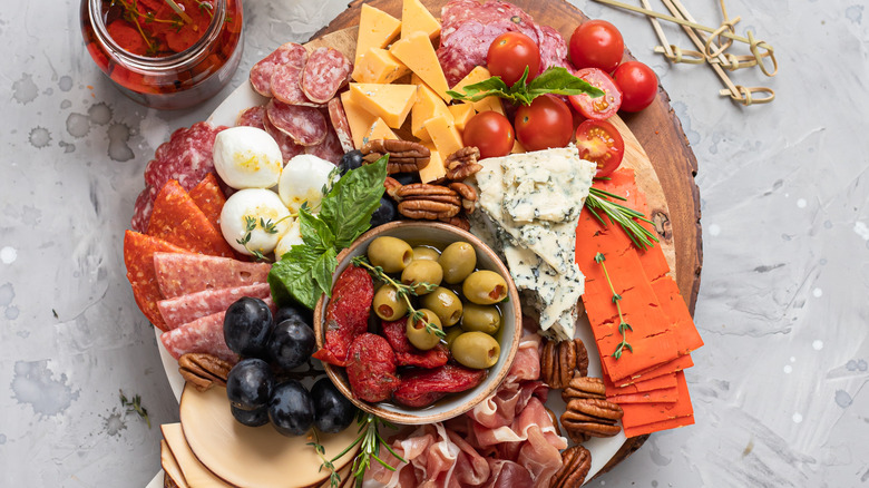 antipasti platter with cheese, meats, and vegetables